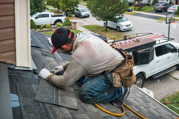Professional Roofing technician working in North Andover, MA